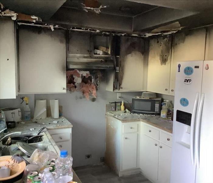 kitchen fire caused by the stove contained to the kitchen area 