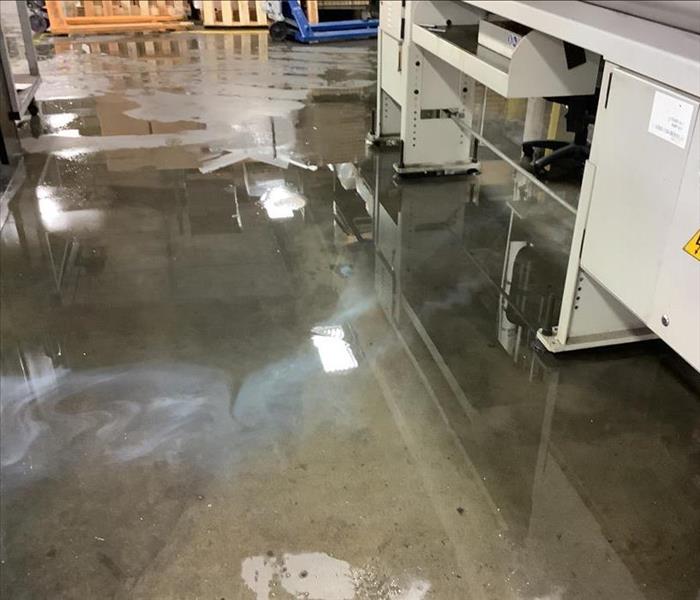 warehouse flooded after a burst water pipe with standing water