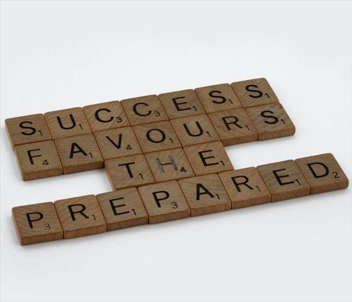Dominoes that say "Success Favors the Prepared"