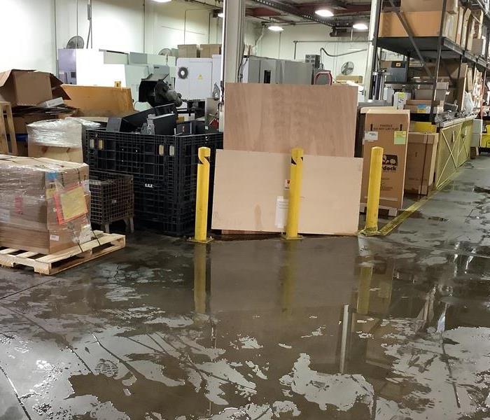 flooded warehouse that suffered water damage from a burst pipe on 2nd floor